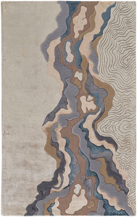 An Abstract Rug With Wavy Lines On The Top And Bottom In Grey Brown Blue Beige And White Colors