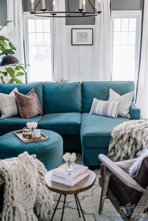 Looking for armchairs with a fancy style to dress up your living room? Eclectic living room with teal velvet sofa, brown leather ...