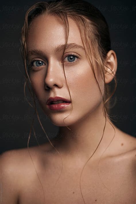 girl with wet hair and red lips high quality clean skin by stocksy contributor danil
