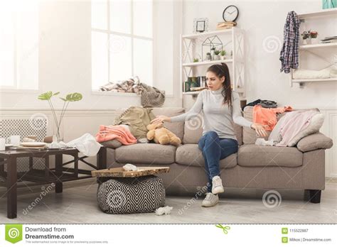 Desperate Woman Sitting On Sofa In Messy Room Stock Image Image Of