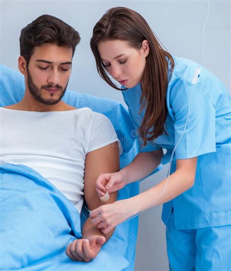 Woman Doctor Examining Male Patient In Hospital Stock Image Image Of