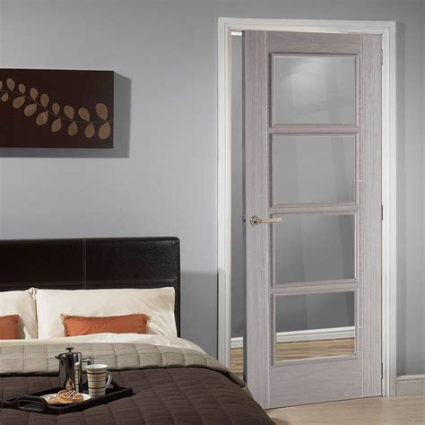 Go for pure white, beige, nude, or even dark grey and black doors. Light Grey Vancouver Door - Clear Glass - Prefinished