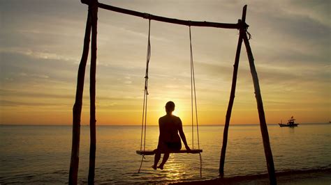 Girl On A Swing By The Seashore On Sunset Stock Video Footage 0014 Sbv