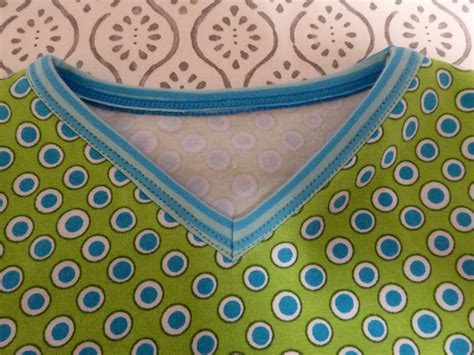 You'll start by prepping the v neckline on the front shirt piece. binding Coverstitching