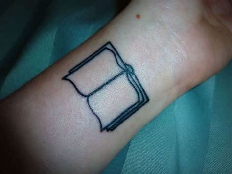 Black Open Book Tattoo On Wrist Except I Want It The Other Way Around