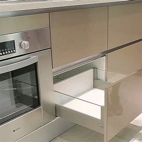Slab kitchen cabinet doors can be designed in multiple ways, and the particular design dictates the price of the cabinets. Slab Kitchen Cabinet Door in Solid Beige - AKC