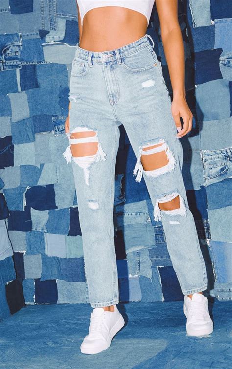 prettylittlething light wash ripped mom jeans cute ripped jeans girls ripped jeans ripped