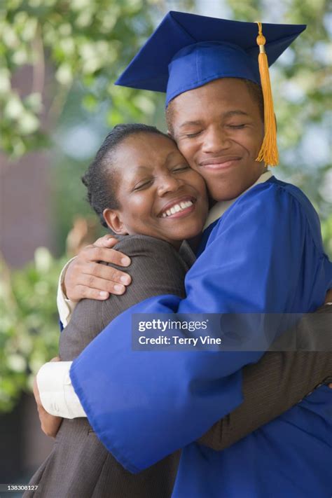 Proud Mother Hugging Graduating Son High Res Stock Photo Getty Images