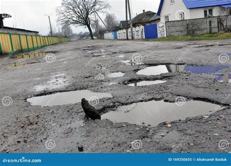 Poor Road Conditions Holes In The Asphalt The Risk Of Driving A Car