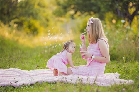 Mother And Daughter Blowing Bubbles Stock Image Image Of Caucasian