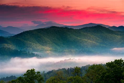 Beautiful Spring Sunrise View Of Layered Mist In The Mountains Of Great