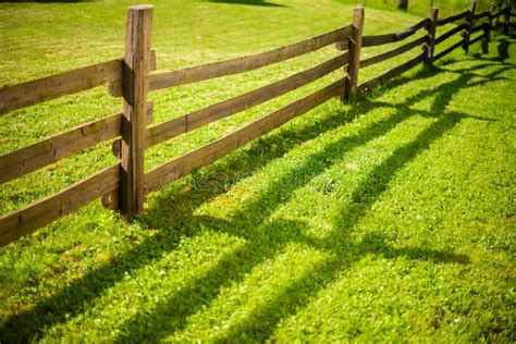 Wooden Fence On Green Meadow Stock Photo Image Of Shadows Farm 77040622