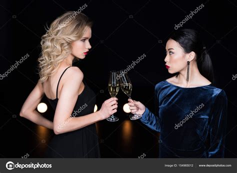 Glamour Girls Clinking With Champagne Glasses Stock Photo