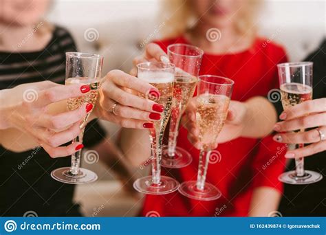 Celebration Hands Holding The Glasses Of Champagne And Wine Making A
