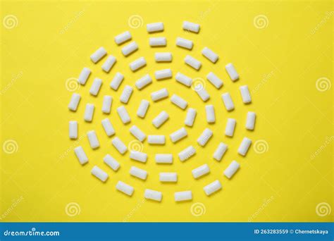 Tasty White Chewing Gums On Yellow Background Flat Lay Stock Image