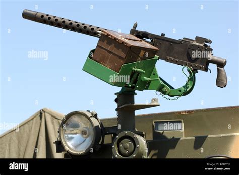 A World War Two Machine Gun Mounted On A Vehicle Or Jeep With An