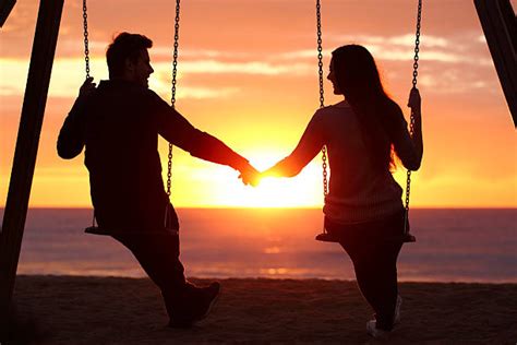 Couple Watching Sunrise Stock Photos Pictures And Royalty Free Images