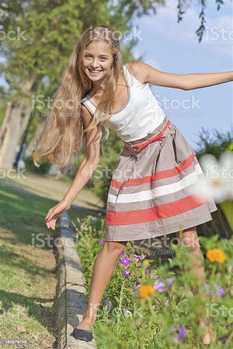 Pretty Teenage Girl Trying To Keep Balance Smiling
