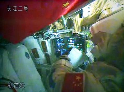 Zhang xiaoguang and wang yaping (2nd chinese. Taikonauts prepare for spacewalk in orbital module ...