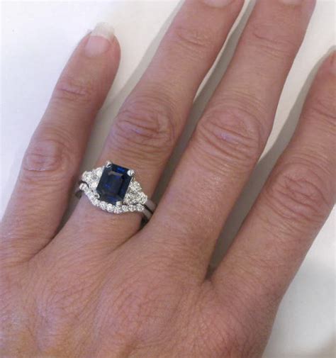 The elegance of emerald cut engagement rings works well with any type of metal, including gold, platinum, or silver. Emerald Cut Rich Blue Sapphire and Round Diamond ...