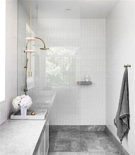 10 Stunning Stone Tile Bathroom Designs That Made Our Editors Do A