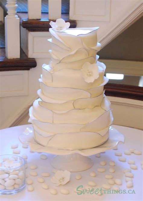 ) and be sure to share the videos with your friends. SweetThings: Ruffled Wedding Cake