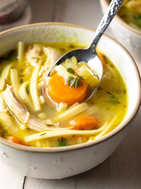Return chicken and broth to pan. Homemade Chicken Noodle Soup Recipe (VIDEO) - A Spicy ...