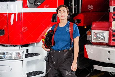 confident firewoman holding helmet against stock image image of attitude fire 58109611