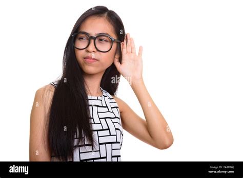 Thoughtful Young Asian Teenage Nerd Girl Listening Stock Photo Alamy