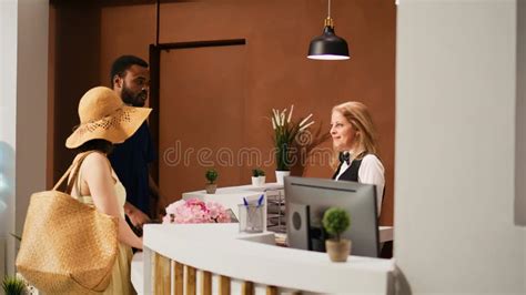 Hotel Staff Welcoming Guests At Counter Stock Photo Image Of