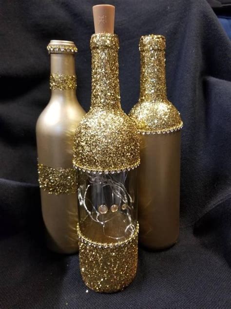Empty jars and wine bottles. Gold Bling lighted decor | Etsy | Glitter wine bottles, Wine bottle diy, Bottles decoration