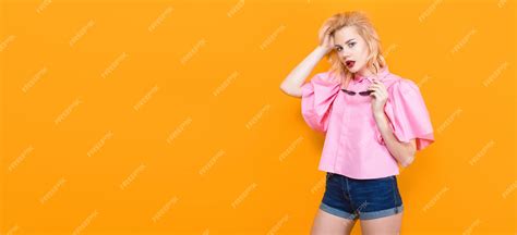 Premium Photo Blonde Woman In Pink Blouse With Sunglasses