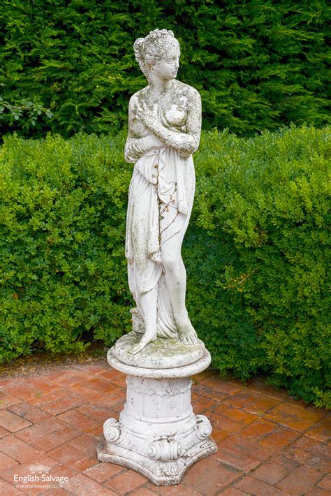 classical female nude garden statue on plinth