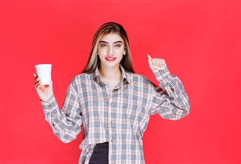 Free Photo Girl In Checked Shirt Holding A White Disposable Coffee