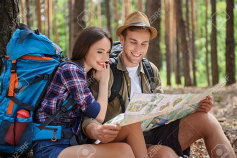 Happy Loving Couple Is Traveling Together In Forest. They Are.. Stock ...