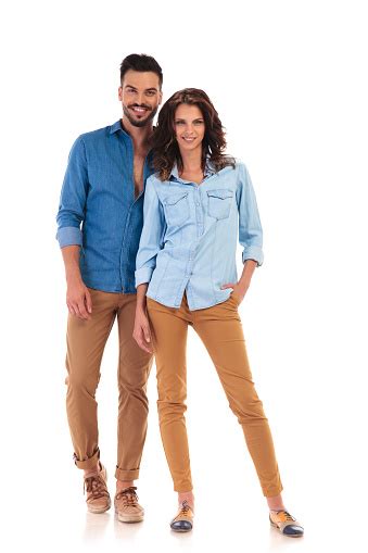Full Body Picture Of Young Casual Couple Standing And Smiling Stock