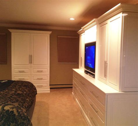 Sleek And Modern Bedroom Entertainment Wall Unit And Armoire In White