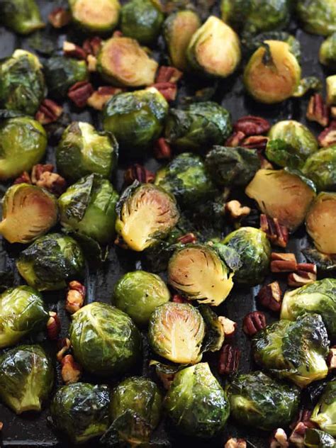 Spread the brussel sprouts onto a rimmed sheet pan, with the cut side facing down. Maple Roasted Brussels Sprouts with Sriracha