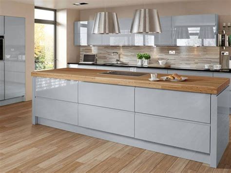 Maybe you would like to learn more about one of these? Ice blue high gloss kitchen with walnut/oak kitchen worktop