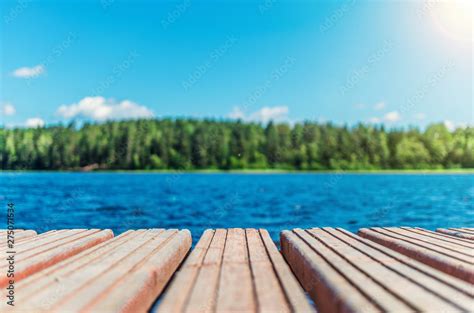 Wooden Timber Of A Rural Mooring On A Lake In The Middle Of The Forest