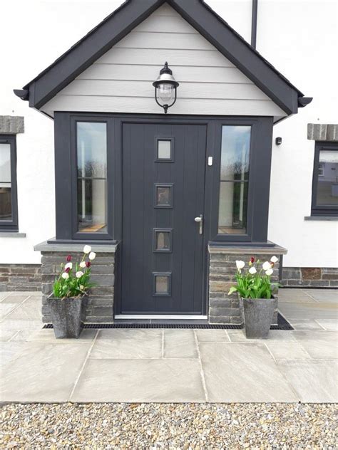 Anthracite Composite Front Door And Marley Cedral Cladding In Light