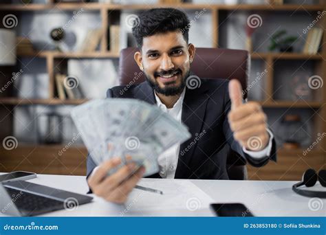 Portrait Of Happy Young Attractive Male Accountant Holding Cash