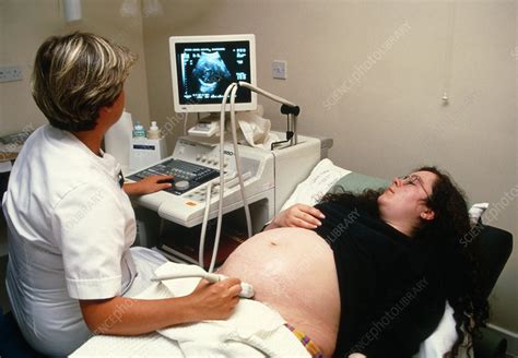 Ultrasound Scanning Of A Pregnant Womans Abdomen Stock Image M406