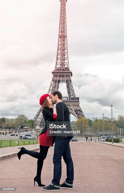 Young Couple In Love At Eiffel Tower Stock Photo Download Image Now
