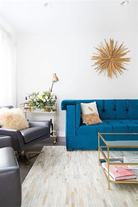 Blue And Gold Living Room Features A Gold Sunburst Clock By Z Gallerie