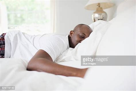 Black Man Sleeping In Bed Photos And Premium High Res Pictures Getty