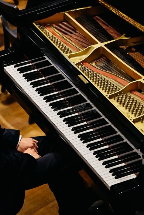 Hands Of Classical Pianist Playing His Piano During A Concert Stock
