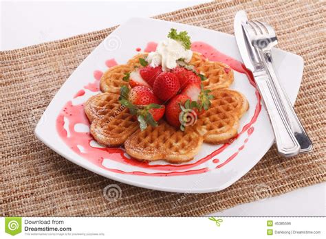 It is drizzled or poured atop various desserts, and is also used for plate decoration. Waffle Topping With Strawberry And Decoration Stock Photo ...