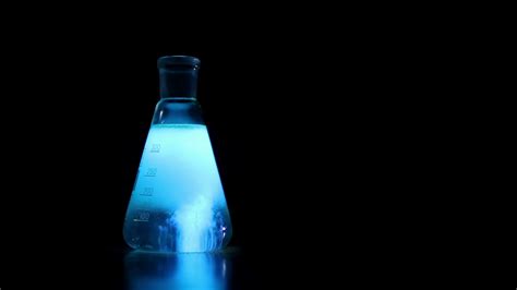 Chemical Experience On Black Background Fluorescent Chemical Reaction