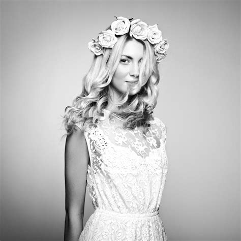 Portrait Of A Beautiful Blonde Woman With Flowers In Her Hair Stock